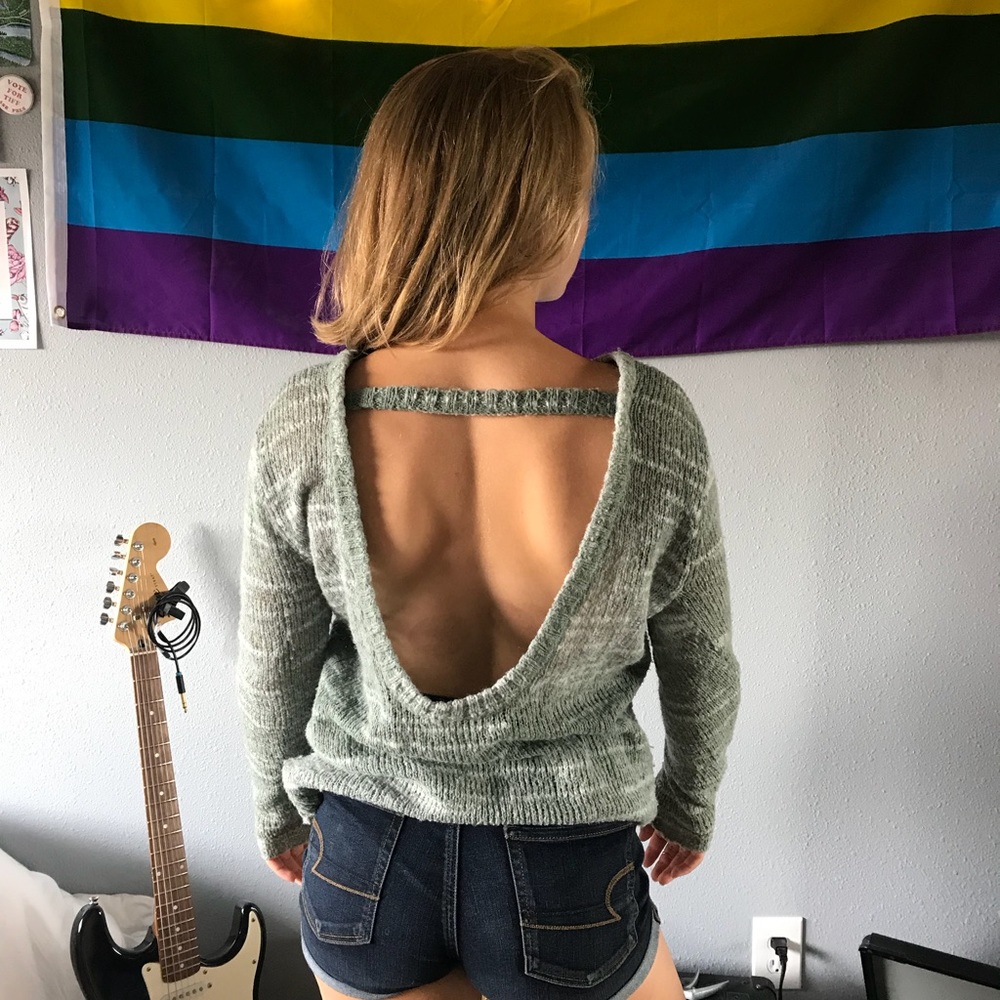 Open back turquoise sweater